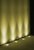 An example of 4 LED ground lights in a line shining up a wall.